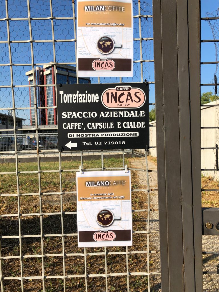 Le due locandine di MilanoCaffè, in italiano e in Inglese esposte all'ingresso su Viale Forlanini 23 della Torrefazione Incas di Fabrizio Nicali